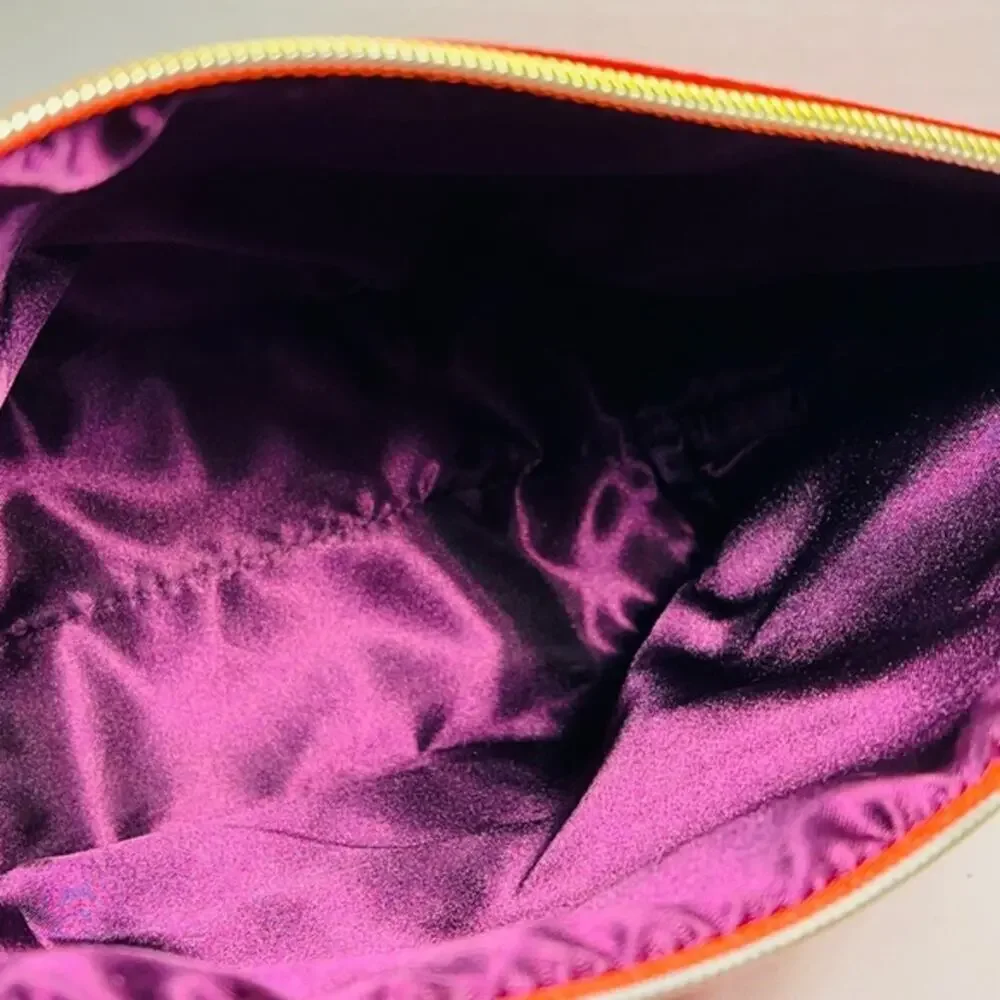 Tarte red cosmetic bag/ clutch, nice size with beautiful purple satin interior